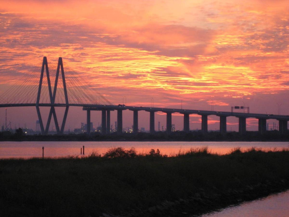 Sunset behind bridge in Baytown Texas for article East/Southeast of Lake Houston