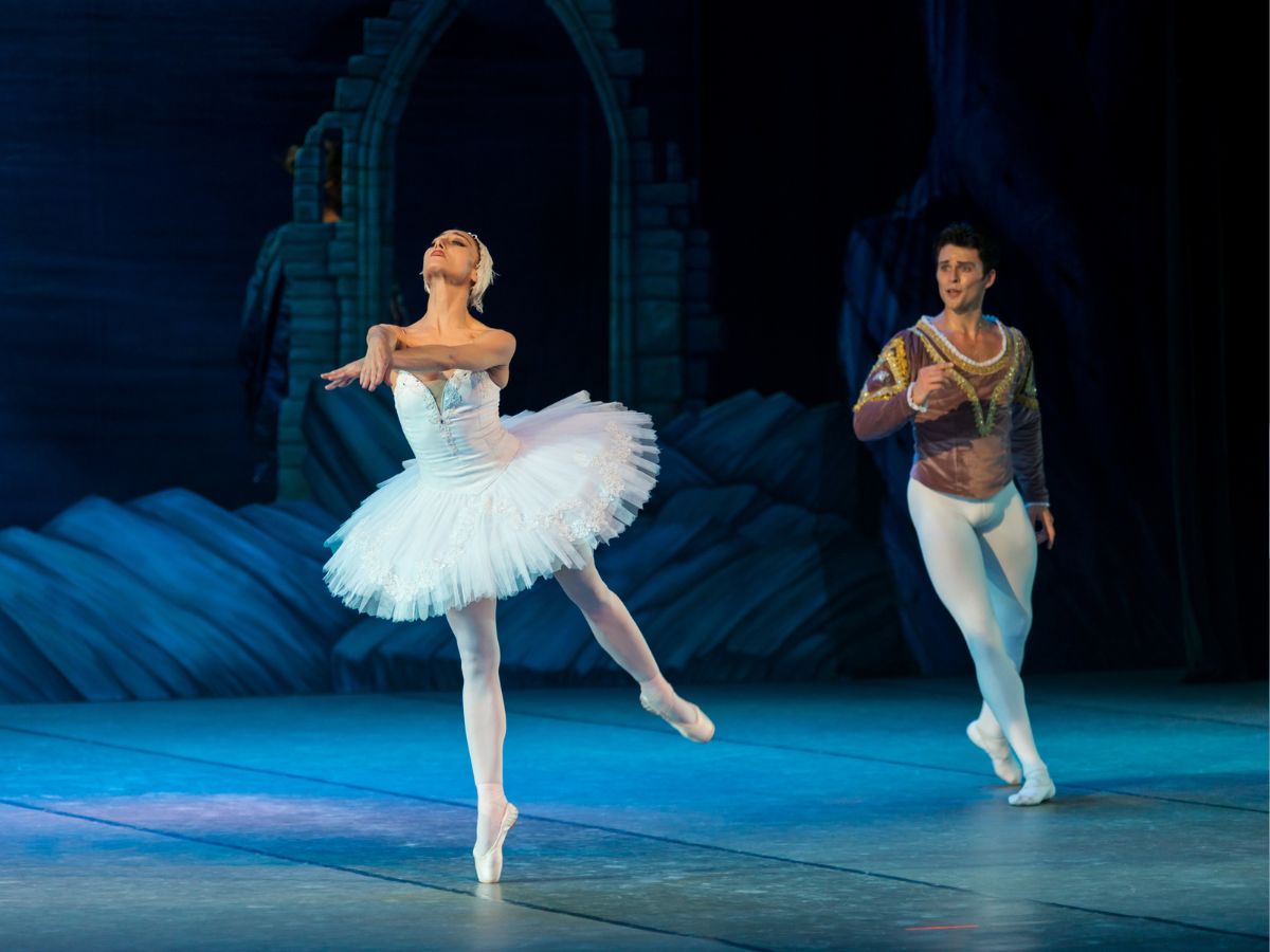 Female and male ballet dancers on stage for article Houston Theater District: 12 to Explore for newcomers moving to Houston.