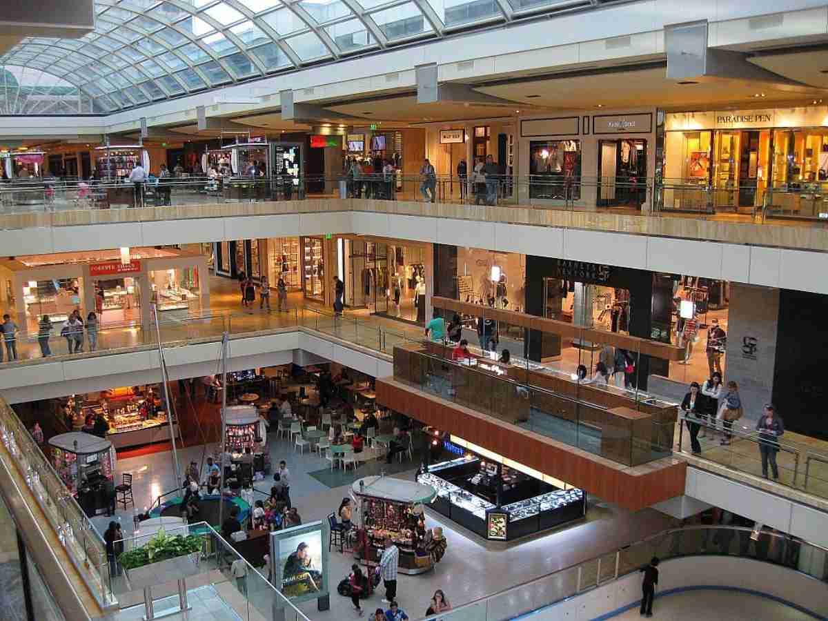 Inside Galleria Mall of Houston showing 3 levels of shopping stores and a skating rink on lower level for article The Galleria Mall in Houston