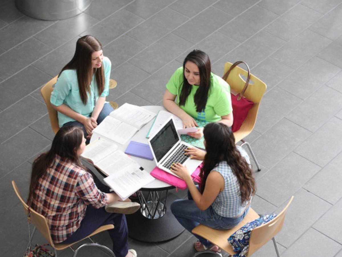 Aerial view of students at table for article The University of Houston-Downtown (UHD)