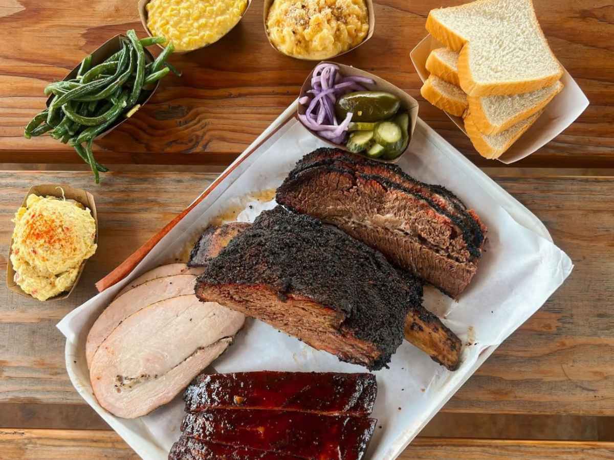 Close up of bbq meat and side options at Killeen's BBQ in Pearland, Texas for article Best restaurants in Pearland for newcomers moving to Houston.