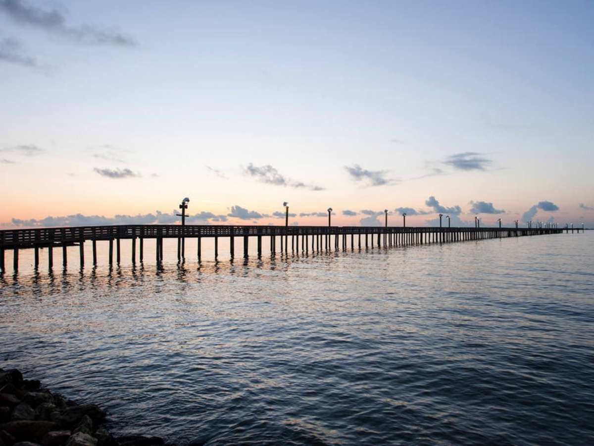 Pier over water in La Porte for newcomers moving to Houston.