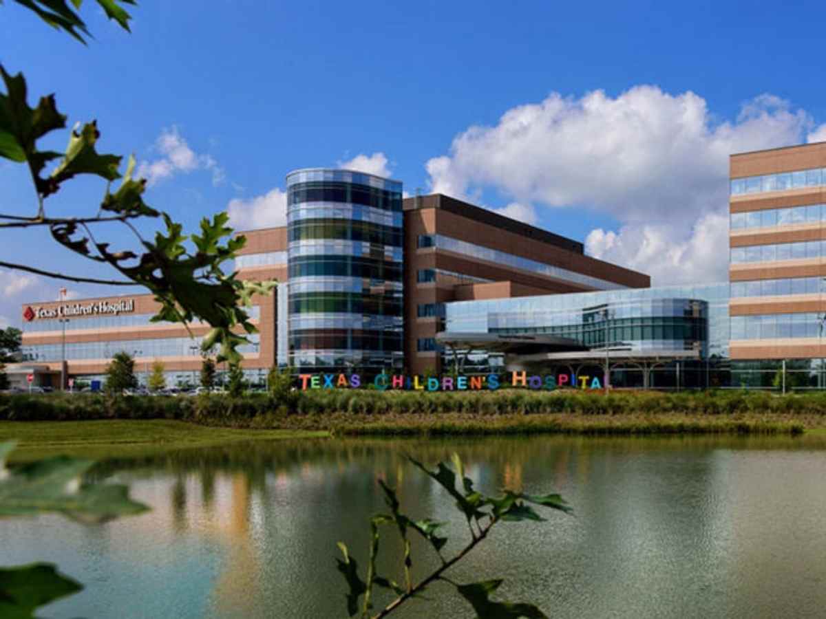 Looking across lake at building for article Texas Childrens Hospital The Woodlands