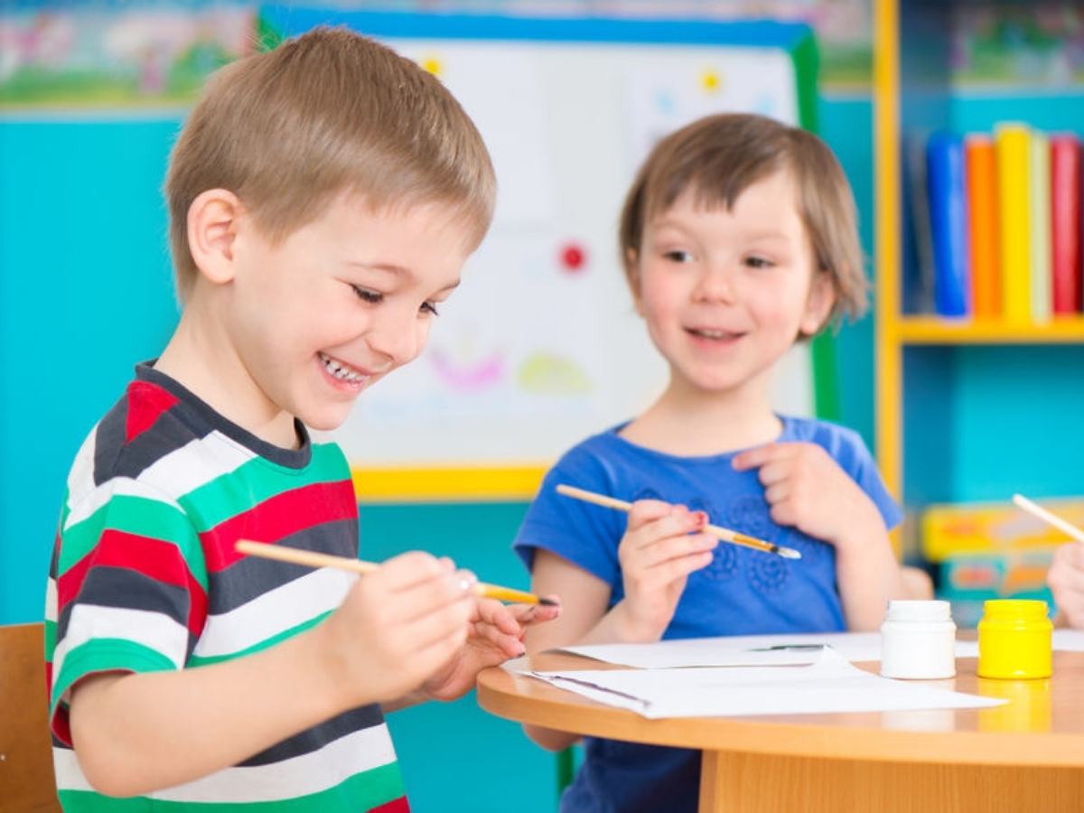2 kids in class painting for article Primrose Schools of Pearland