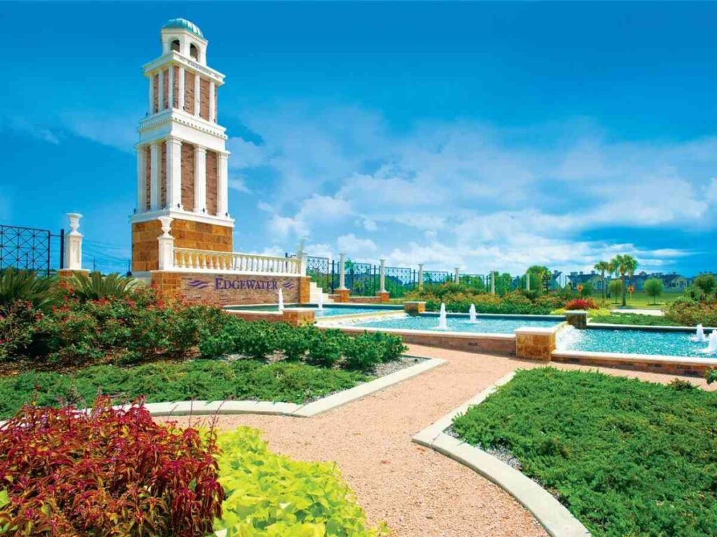 Fountain, monument, and walking path at Edgewater for article 7 Unbeatable Reasons Edgewater Wows Newcomers for people moving to Houston.