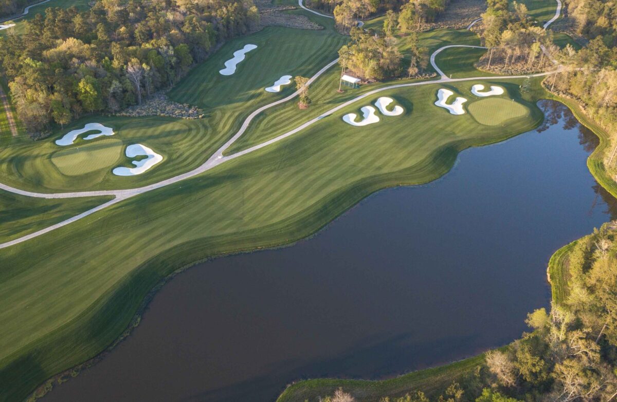 Drone image of a pond beside a hole at Golf Club of Houston