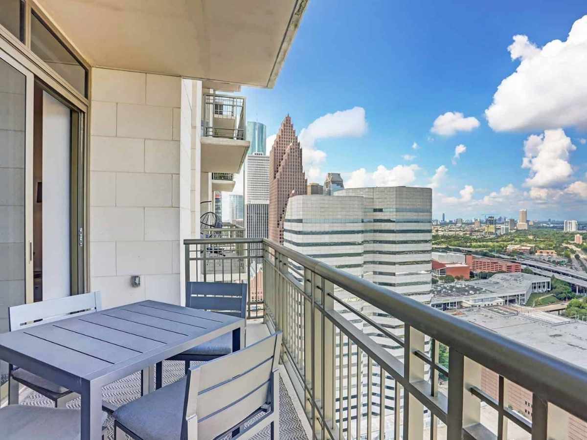 High rise balcony with view of downtown Houston for article Luxury Apartment Living in Houston for newcomers moving to Houston.