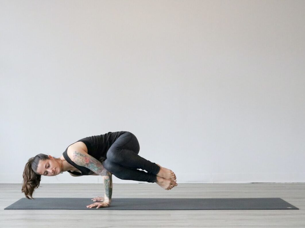 woman doing advanced yoga pose