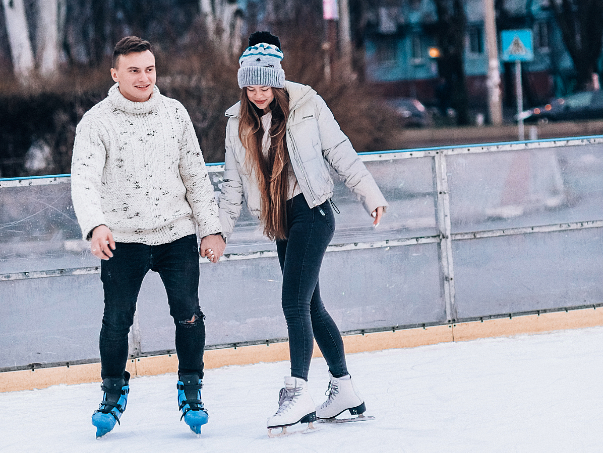 Young Couple ice skating outdoor rink - for article Houston Ranks 9th Most Fun City in America for newcomers moving to Houston.