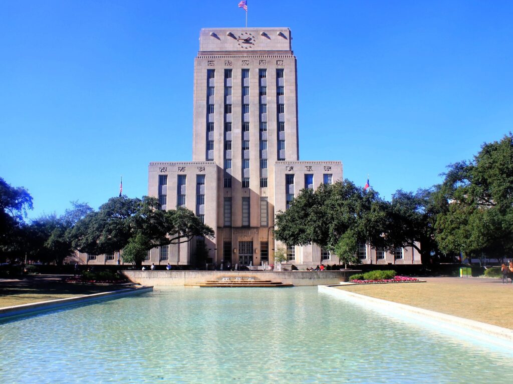 Houston City Hall with a clock on the front, voting in Houston