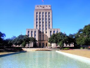 Houston City Hall with a clock on the front, voting in Houston